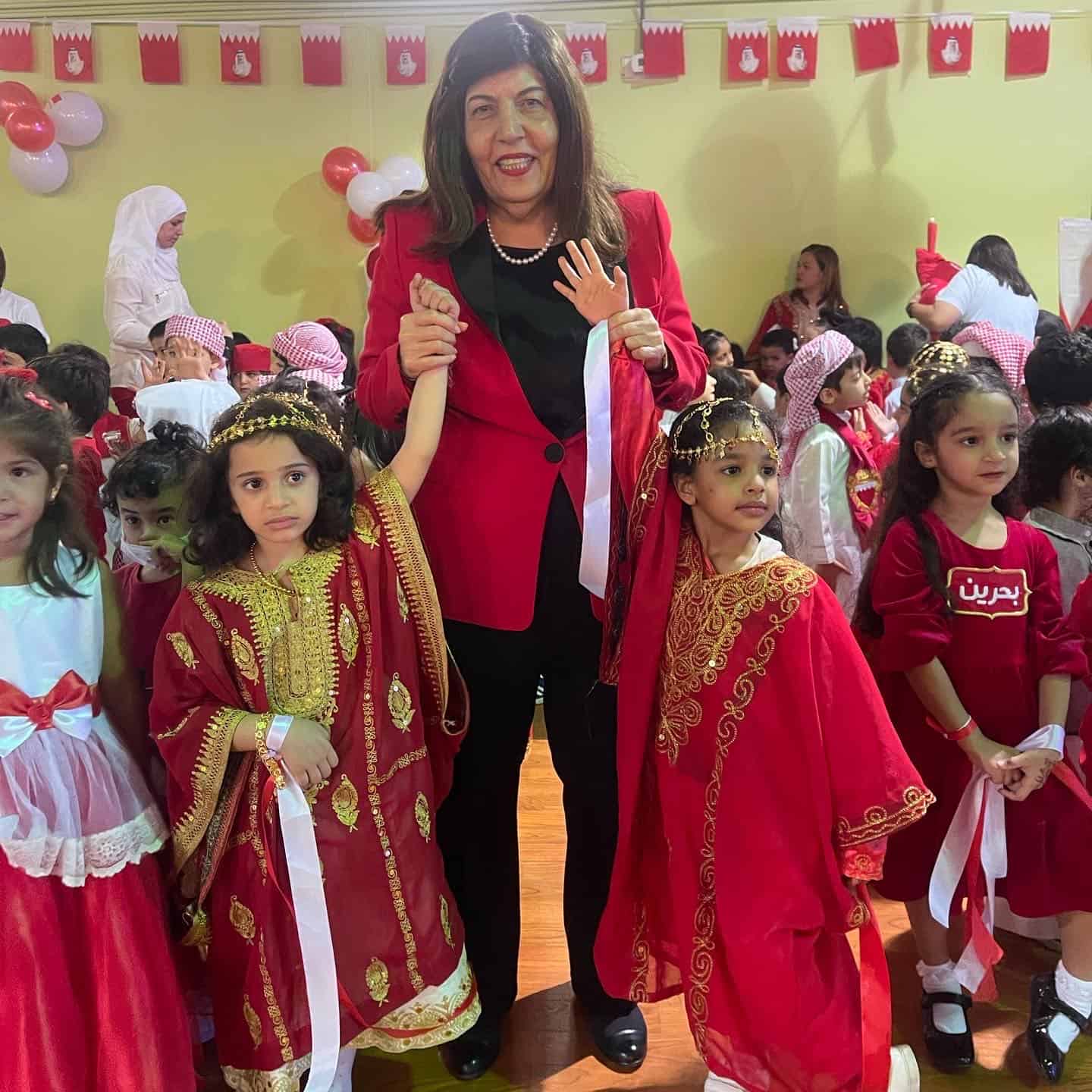 Festive school celebration with children in traditional attire at MKS International School Bahrain, showcasing cultural diversity, student participation, classroom activities, and vibrant decorations for cultural events.