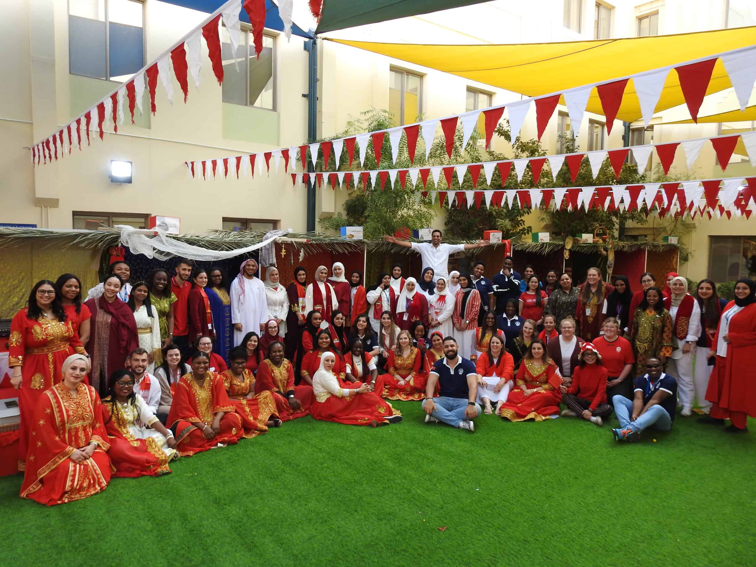 Vibrant multicultural celebration at MKS school with students and staff in traditional attire, colorful decorations, and festive atmosphere highlighting diversity and community spirit.